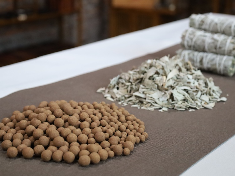 The handmade process of white sage incense pellets, showing raw dried sage leaves transitioning into hand-rolled incense balls.