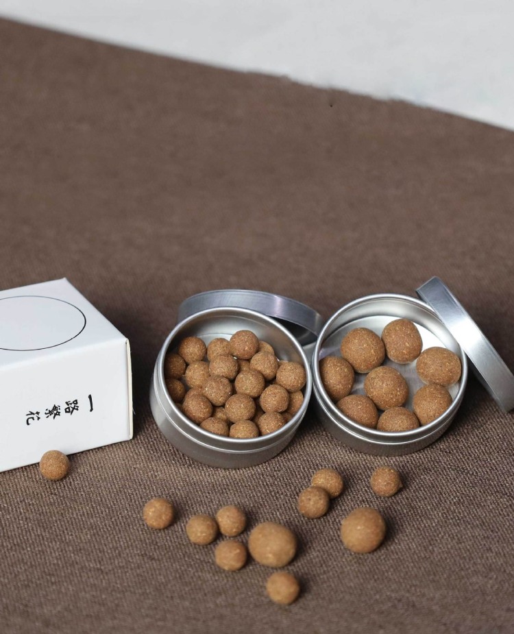 Premium aluminum tins and minimalist white box packaging for handmade white sage incense pellets, wholesale retail ready