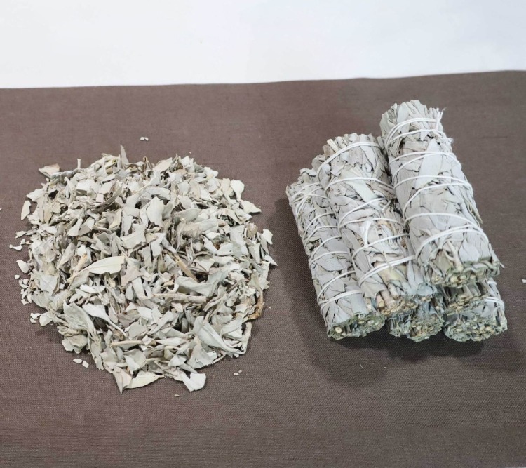 Bulk raw California white sage leaves and smudge sticks, demonstrating our large-scale natural raw material sourcing.